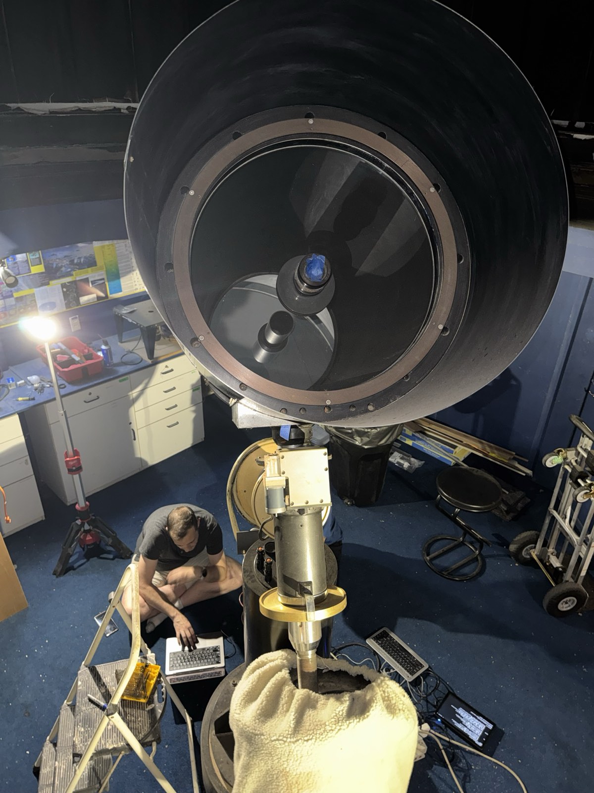 David at a laptop beneath the 20-inch telescope